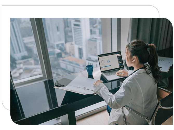 A women is Working in the laptop about health care information.