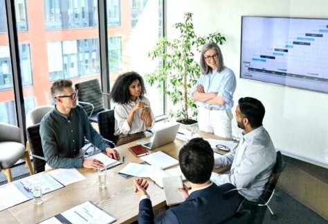 Our Customer Voices, group at a staff meeting