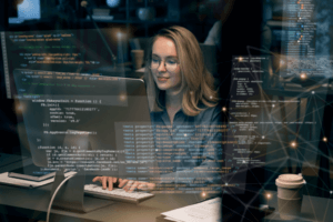 Woman at computer looking at IT data